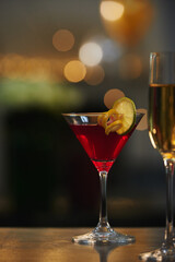 Restaurant, nightclub and glass of alcohol on counter for toast on weekend, holiday and booze. Bar, liquor and cocktail drink with fruit for serving at party, new years eve celebration and festival