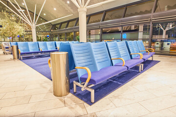 Airport, terminal and seats with waiting area for travel, journey or international flight of indoor port. Empty, lounge or space of transportation or station room for departure, bording or arrival