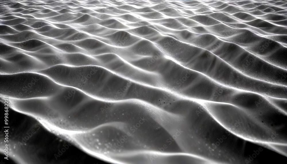 Aufkleber a close-up view sandy beach, with the sand grains arranged in a repeating pattern of ripples and waves The grainy texture and the interplay of light and shadow create