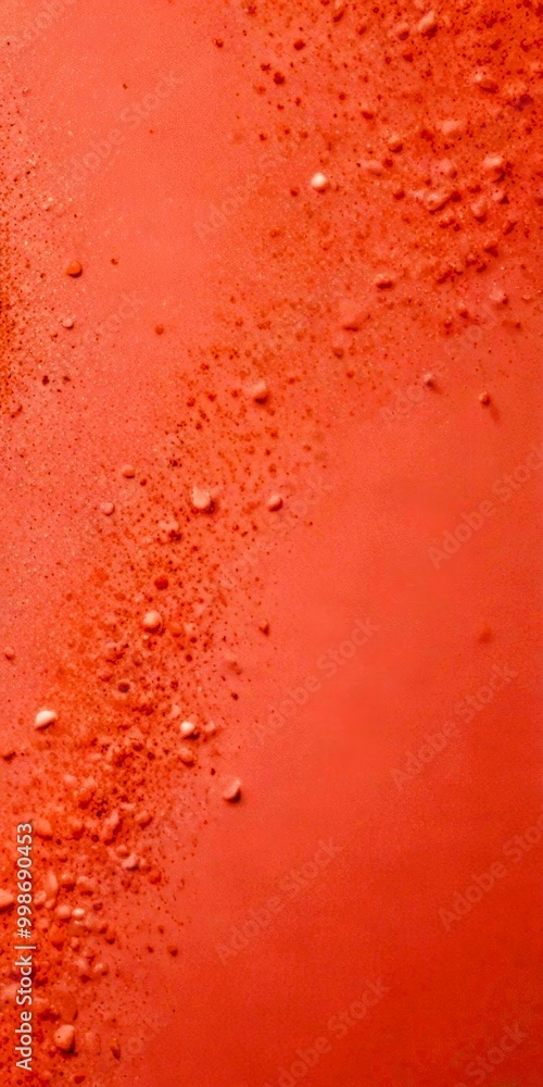Poster a close-up view pinkish-orange surface with small white specks scattered across it, creating a textu