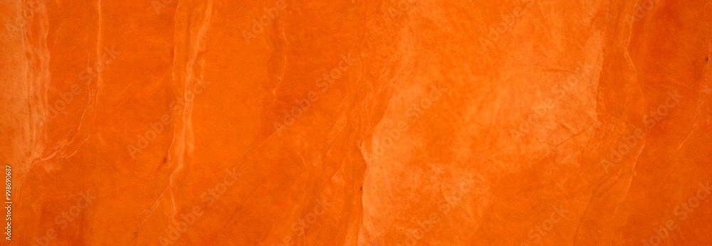 Aufkleber a close-up view textured orange-colored surface, possibly a stone or marble, with a subtle pattern o