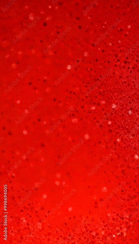 Poster a close-up view red liquid surface with numerous small white dots scattered across it, creating a textured and speckled appearance