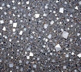 Fototapeta premium a close-up view textured surface composed of small, irregularly shaped white and gray stones or pebbles