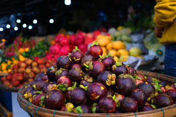 Pile of mangosteens at fruit market in Vietnam