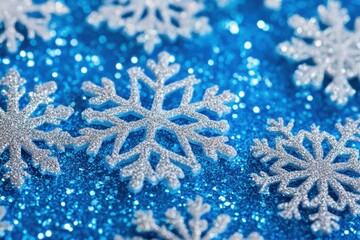 Sparkling blue glitter background with white snowflakes