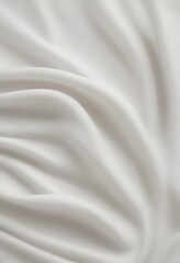 Fototapeta premium a close-up view white fabric surface, with the fabric appearing to be made of silk or satin and exhibiting a smooth, flowing texture