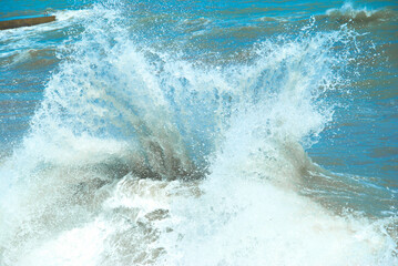 Big wave with sea foam and blue water