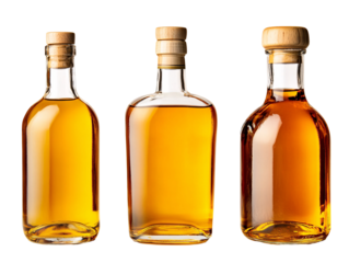 a group of bottles with brown liquid