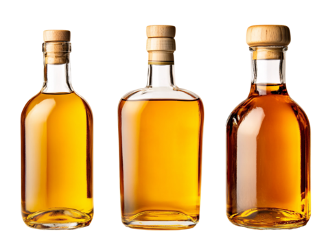 a group of bottles with brown liquid