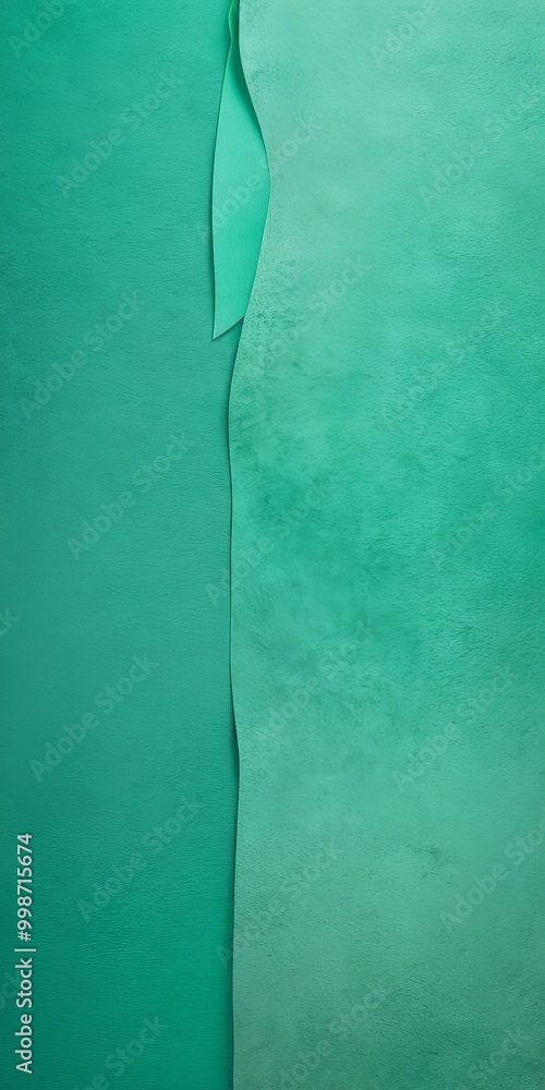 Aufkleber a vertical line cutting across a textured green background, creating a sense of depth and dimension