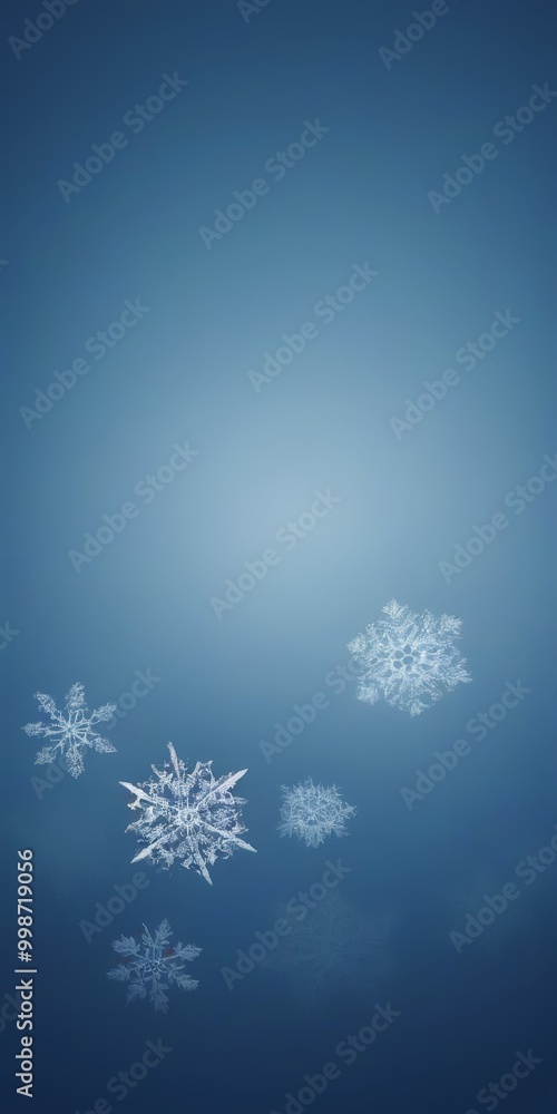 Poster Snowflakes float against a deep blue background, creating a serene and tranquil atmosphere