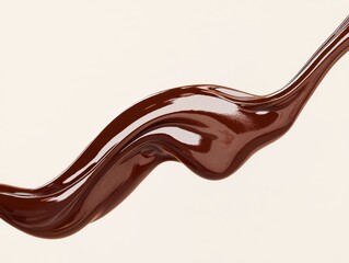 Close-up of rich, smooth liquid chocolate syrup gracefully flowing against a clean white background.