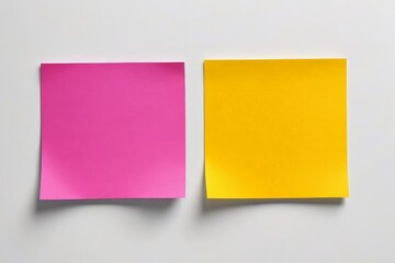 Fototapeta premium two pieces of paper are placed on a white surface