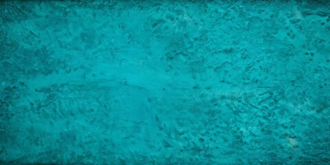 a close-up view textured surface with a vibrant turquoise color The surface appears to be made material that resembles stone or concrete, with a rough and
