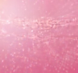 Fototapeta premium a blurred, abstract representation pinkish-purple background with a subtle pattern of small white dots or specks