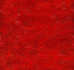 a close-up view red, textured surface with a repeating pattern of curved lines and dots, creating a sense of movement and depth
