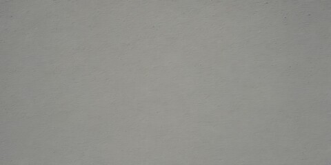 A gray, textured wall with a subtle pattern, resembling a canvas or a plain background