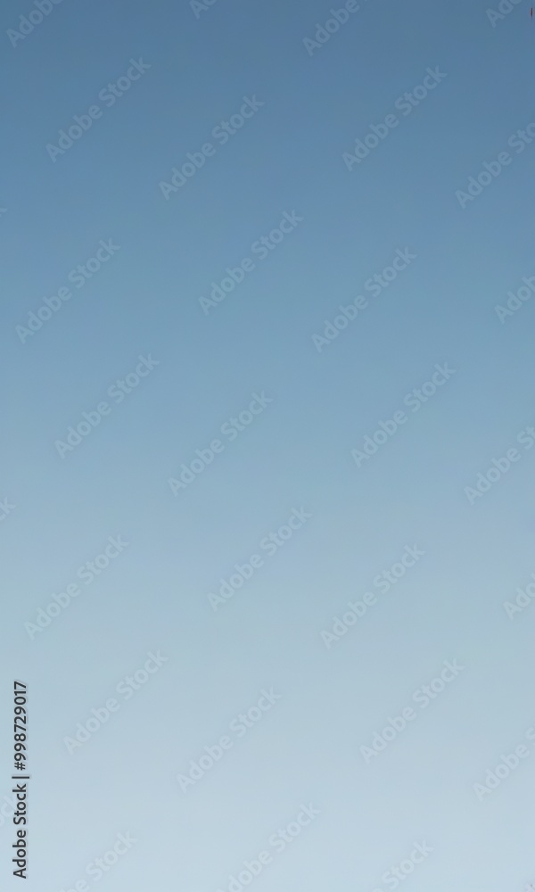 Aufkleber a gradient of blue sky, transitioning from a darker shade at the top to a lighter one at the bottom