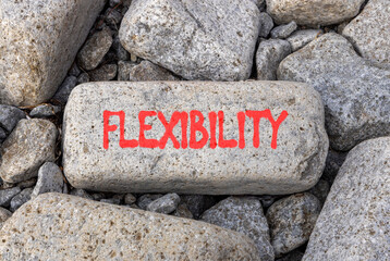 Flexibility symbol. Concept word Flexibility on beautiful grey volcanic stone. Beautiful grey...
