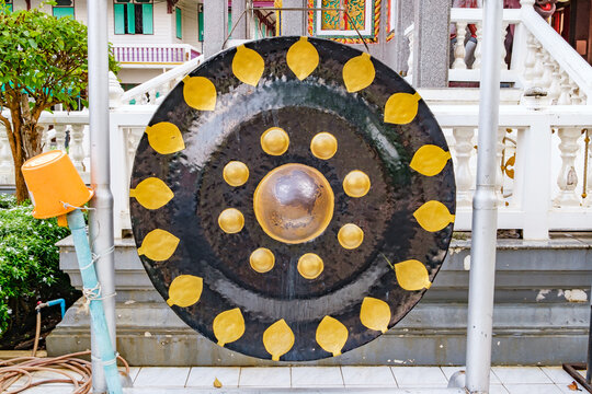Phuket, Thailand - April 20, 2024: round large Buddhist drum Gong in Thailand, Ladthi Wanaram Temple, Wat Tai