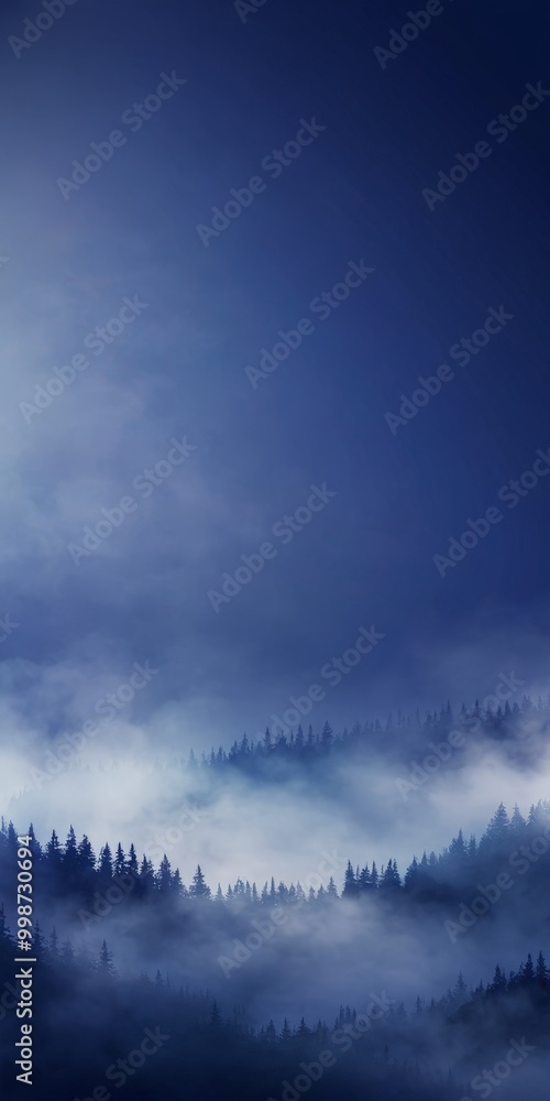 Poster A serene landscape with a forest of pine trees partially obscured by a layer of fog, set against a deep blue sky