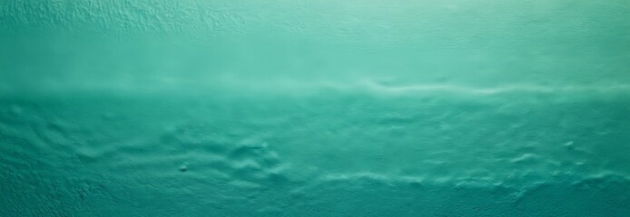 a close-up view textured surface with a gradient of turquoise colors, resembling the ocean or a body of water