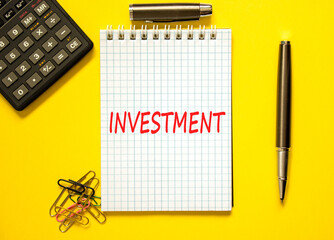 Investment symbol. Concept word Investment on beautiful note. Beautiful yellow paper background....