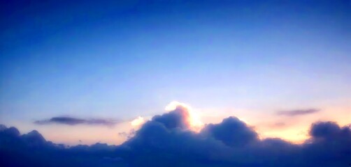Obraz premium A serene sky with a few wispy clouds at sunset, captured from a high vantage point