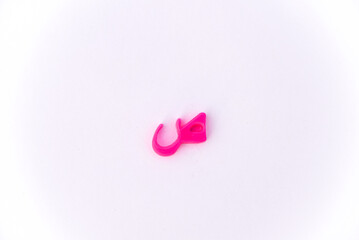 letter Sad, Arabic letter S, Small model of the Arabic letter S in pink color isolated on a white...