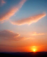 Fototapeta premium A breathtaking sunset over a mountainous landscape, with the sun partially obscured by clouds and the moon visible in the sky