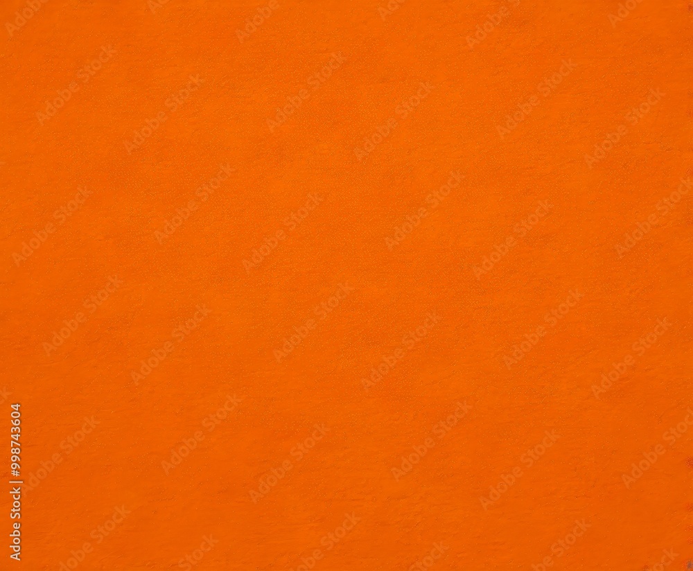 Poster a close-up view textured orange surface, resembling a piece of fabric or a canvas the surface has a 