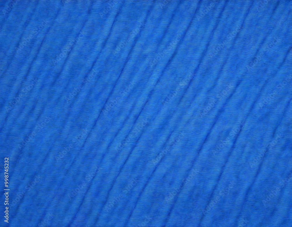 Poster a close-up view of a blue fabric with diagonal lines, creating a textured and patterned appearance.