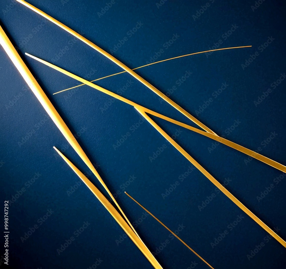 Aufkleber a close-up view of several thin, golden-colored metal rods or wires arranged in a diagonal pattern against a dark blue background