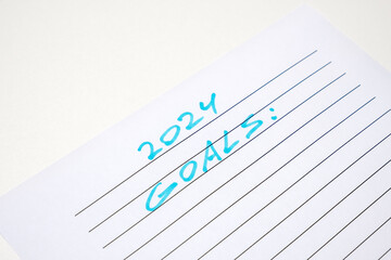 Obraz premium 2024 Goals handwritten inscription in blue on white paper