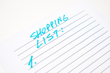 Shopping list handwritten inscription in blue on white paper