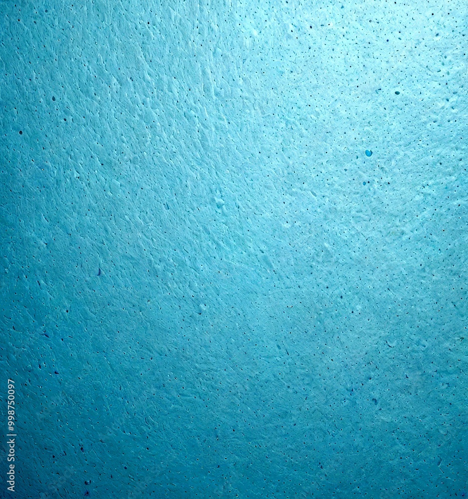 Poster a close-up view textured blue surface, possibly a wall or a window, with small white dots or specks scattered across it, creating a sense of depth and dimension