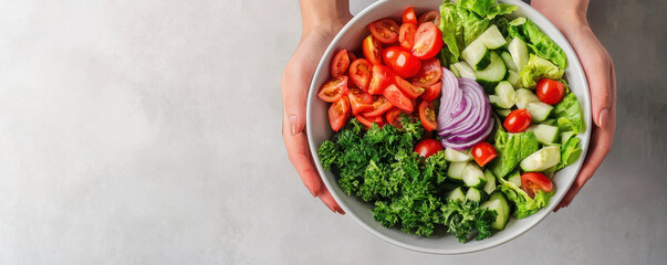 Fresh ingredients are essential for balanced meal, as seen in this vibrant bowl of salad filled with tomatoes, cucumbers, and leafy greens, showcasing healthy eating habits