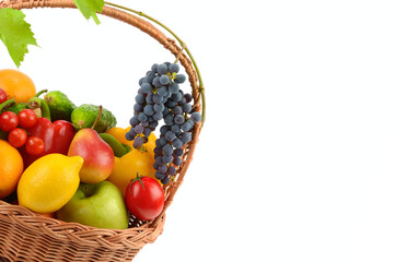 vegetables and fruits in a wicker basket isolated on a white background. Free space for text.