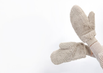 warm fluffy mittens in the hands of a woman