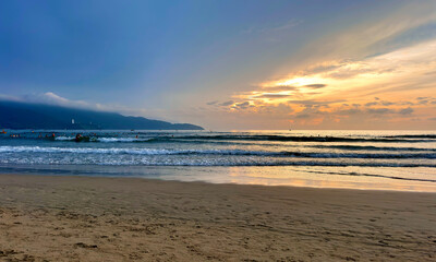Sunrise on My Khe beach, Da Nang - In front is Son Tra peninsula