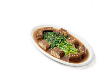 Stir-fried black tofu with Chinese kale