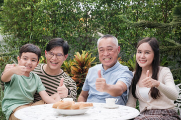Happy Asian family Grand parent father mother and kid spending time in vacation