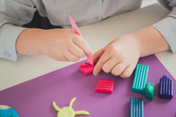 Photo of cute adorable skilled girl sitting table creative handiwork creation art courses indoors