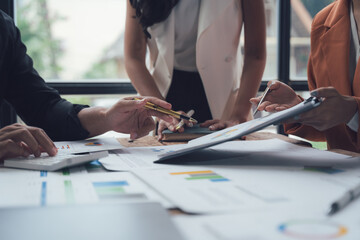 Focused Collaboration: A diverse team of professionals leans in, engrossed in a collaborative...