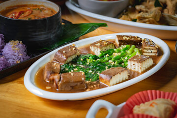 Stir-fried black tofu with Chinese kale