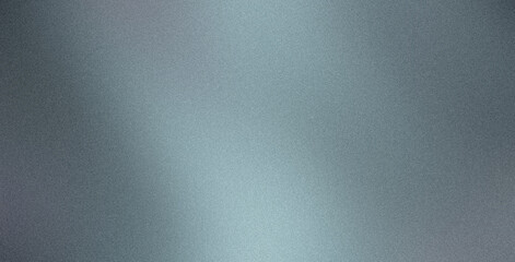 Subtle grainy texture created by light reflecting off a brushed metal surface