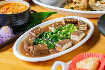 Stir-fried black tofu with Chinese kale