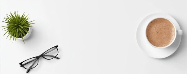 Coffee cup, glasses, and potted plant on a clean white background for a cozy workspace atmosphere.