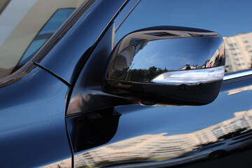 Large rear view mirror with side camera luxury suv. Side rear mirror of car. Turn signal repeater...