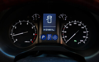Fototapeta premium Analog speedometer on car interior dashboard. Tachometer in a car. Analog dashboard car. Instrument arrows.